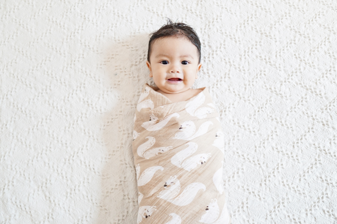 Baby fights online swaddle