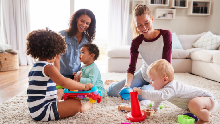 Toddlers playing together on floor