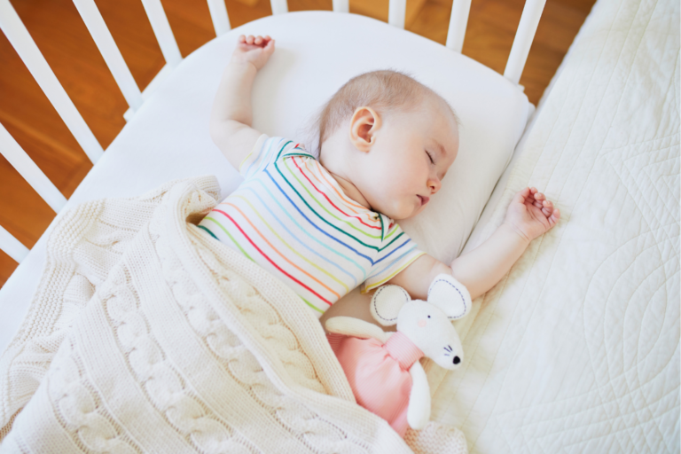 Baby sleeping in a cot- Managing sleep challenges